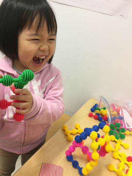 Child playing at East River CDC